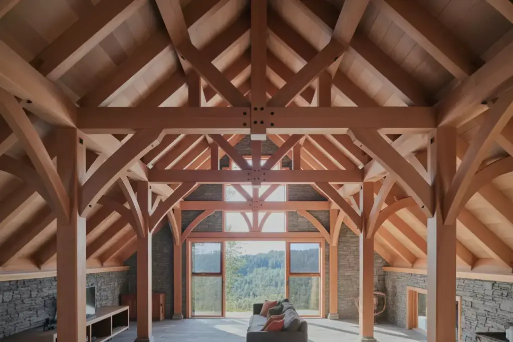 Timber Frame Cabin Interior With Exposed Oak Beams And Stone Infill Walls