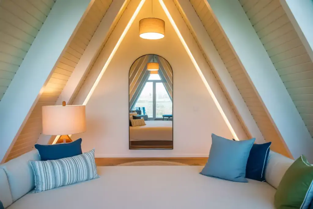 Bright A Frame Interior With Light Colors And Layered Lighting For Illusion Of Space