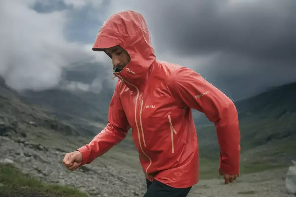 13 Hiker In Waterproof Shell Jacket Facing Wind And Rain With Pit Zips Open