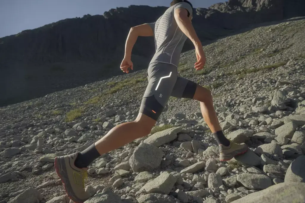 The Technical Performance System Hiker In Ventilated Shirt Shorts On Steep Terrain