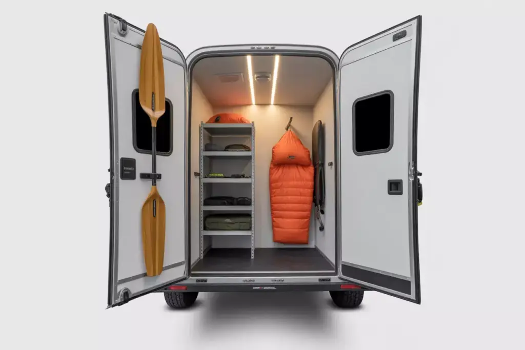 Interior Of Enclosed Trailer Showing Organized Shelves And Stored Gear