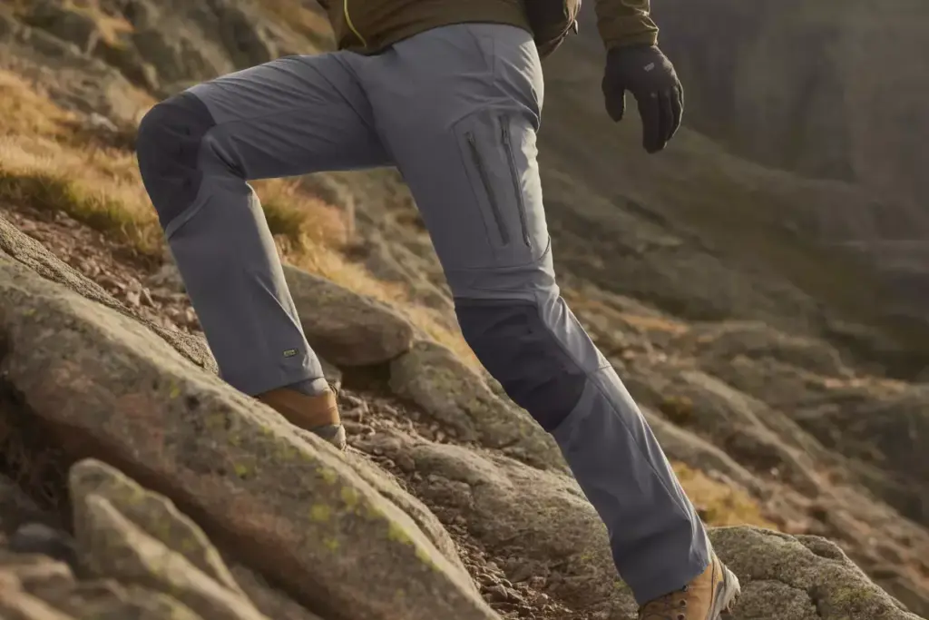 24 Hiker Wearing Technical Pants With Articulated Knees On Rocky Trail