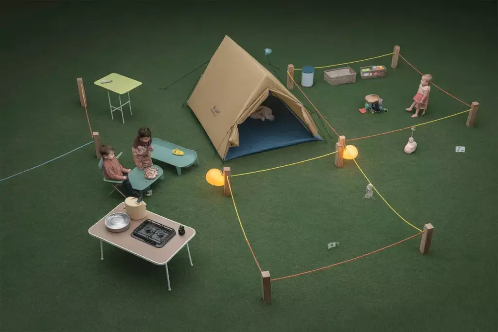 Aerial View Of Organized Campsite With Zones For Sleeping Cooking And Play