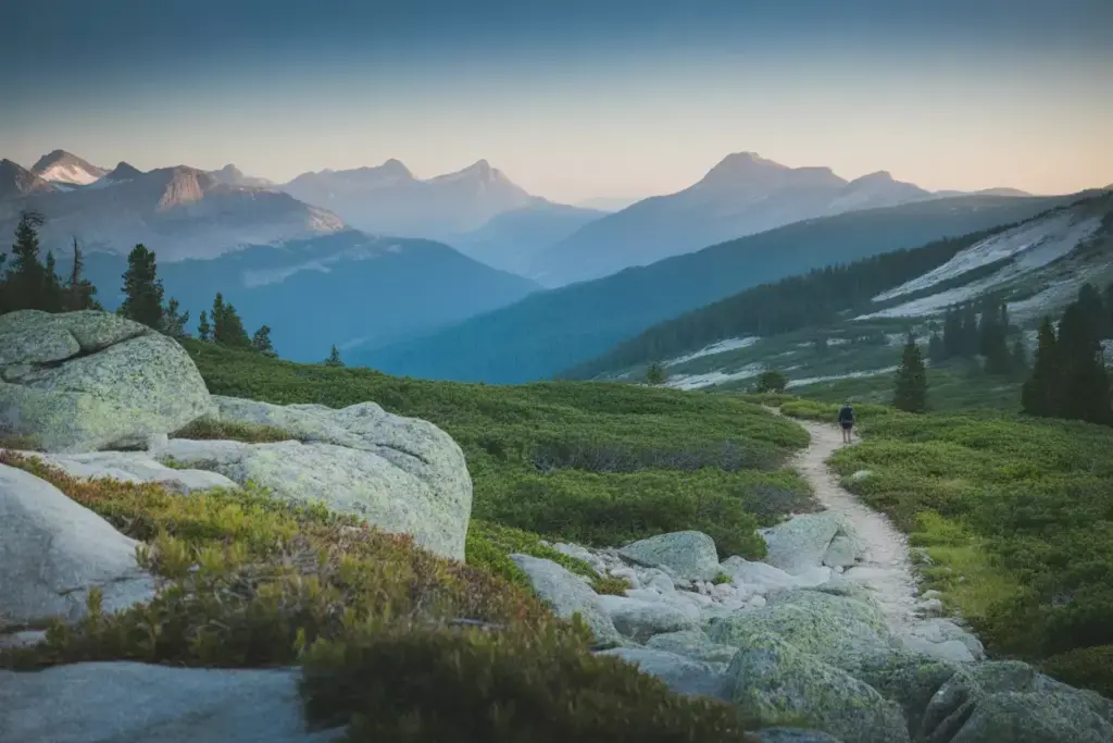 Composition Techniques That Transform Mountain Landscapes With Layering Leading Lines And Human Silhouette For Scale