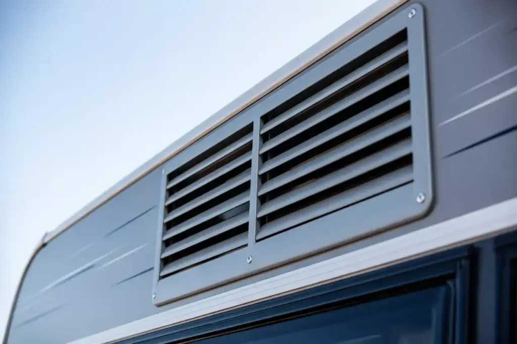 Exterior View Of A Clean Unobstructed Caravan Fridge Upper Ventilation Louver Panel