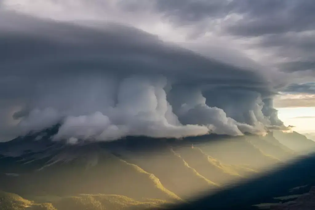 34 Dramatic Mountain Scene With Storm Clouds Clearing And Sunlight Breaking Through