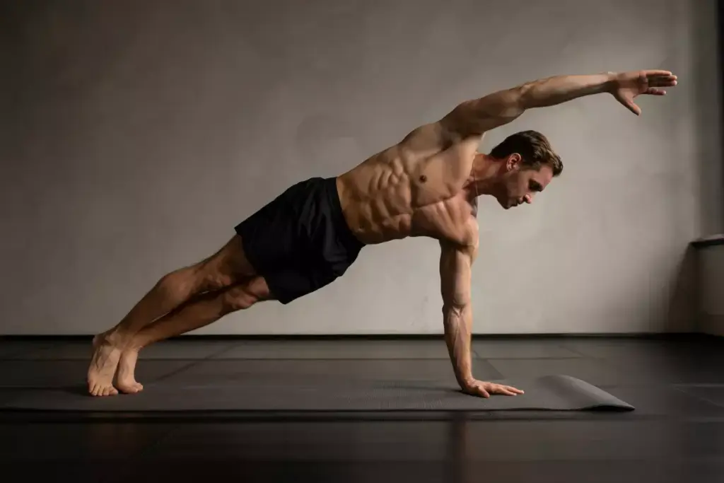 Male Hiker Performing Dead Bug Exercise Lying On Back Lowering Opposite Arm And Leg