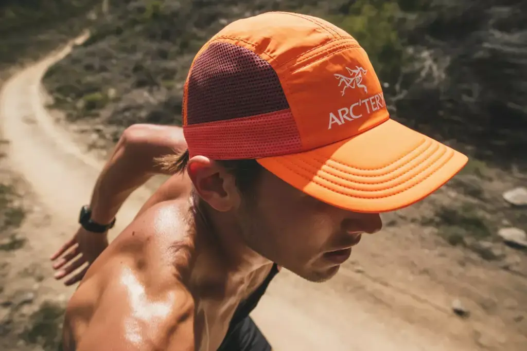 Arc Teryx Norvan Trucker Hat On Trail Runner With Sweat And Mesh Ventilation