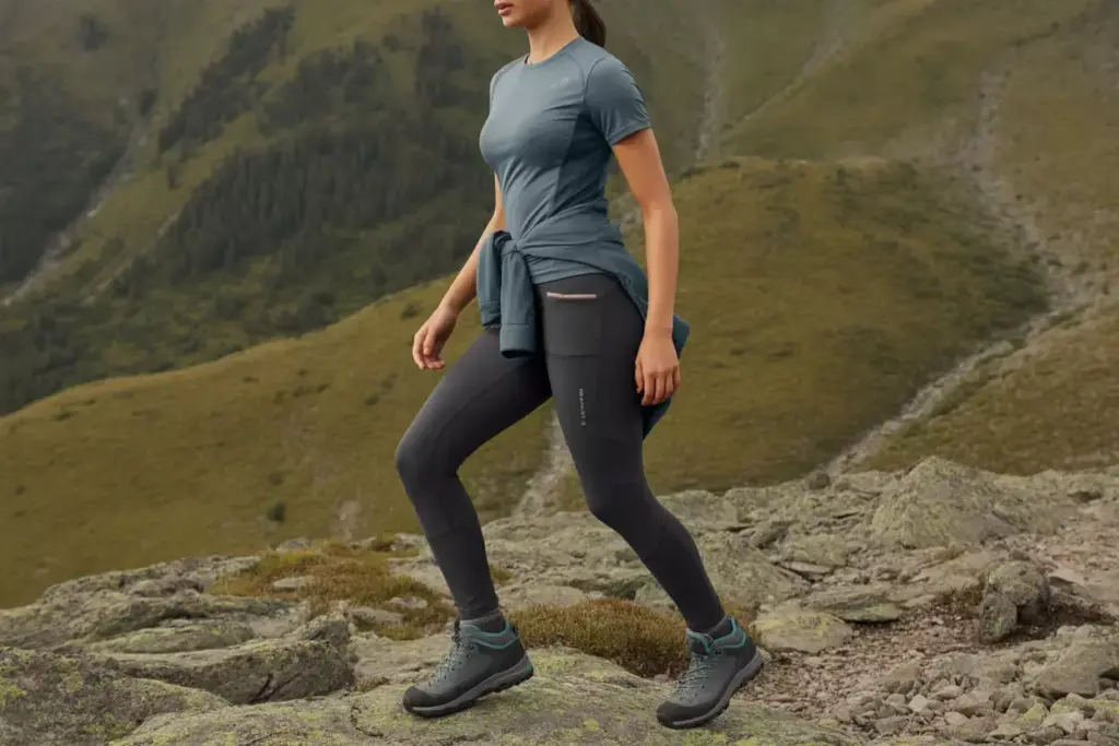 The Versatile All Day Comfort Hiker In Stylish Performance Outfit On Mountain