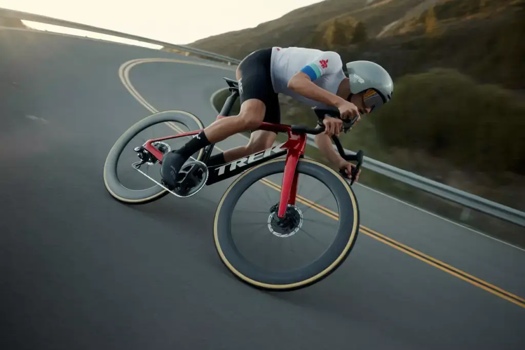 Trek Madone Slr 9 Aero Road Bike Cornering Fast On Mountain Descent During Golden Hour